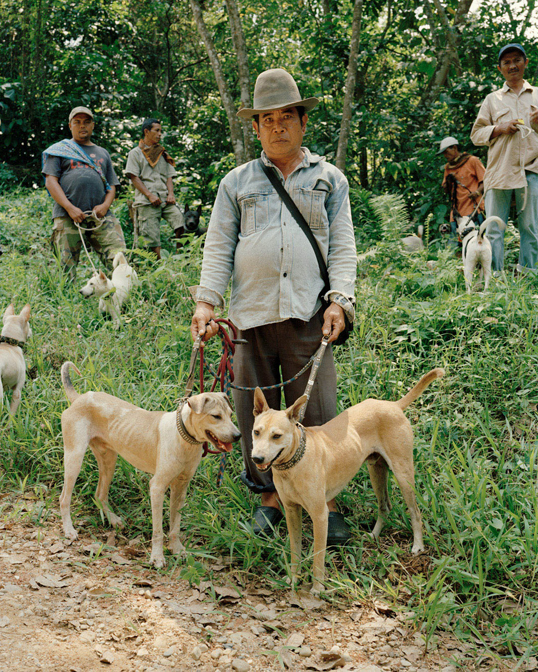 Scott Dietrich, Untitled, Hunter with Group, Sumatra, 2013