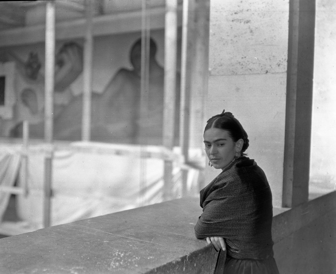 Frida Kahlo on balcony above Detroit Industry Murals, courtesy of DIA Archives