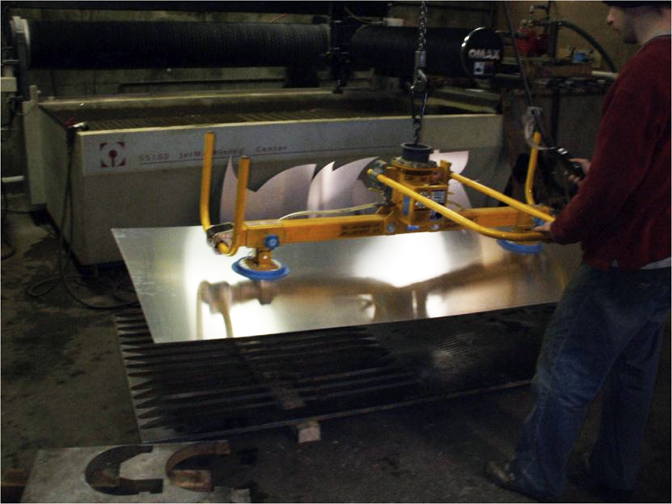 Todd Reed working in the tool and die shop where the shapes were cut from aluminum, 2015