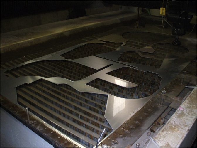 Todd Reed working in the tool and die shop where the shapes were cut from aluminum, 2015