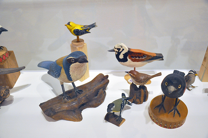 Tony Fitzpatrick: The Secret Birds, Installation view of hand crafted wooden birds, DePaul Art Museum, Chicago, IL, 2016