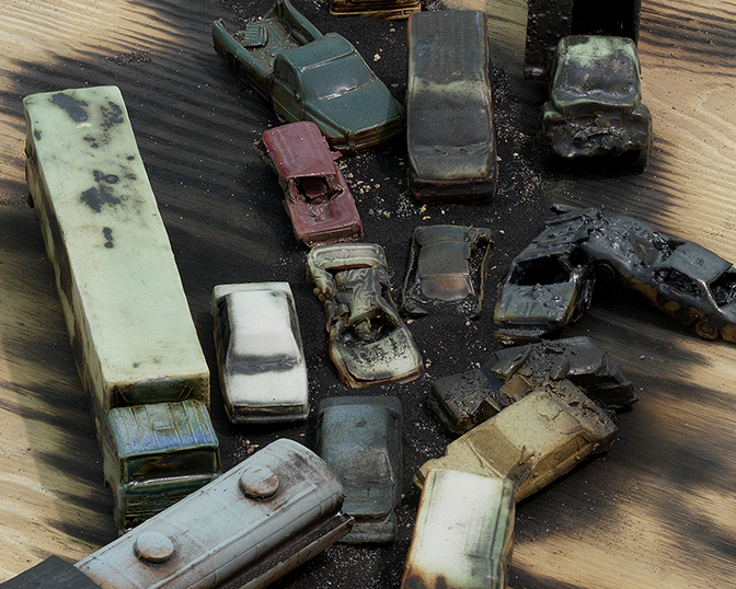 Alison Ruttan, “Line in the Sand”  (detail), 2015 Slip Cast Ceramics, wood, burnt wood, sand, black sand 