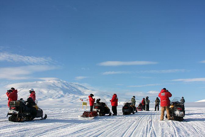 Mike Paro, snowmobile trip to the world's southernmost active volcano, Mt. Erebus, with coworkers at McMurdo Station, Antarctica