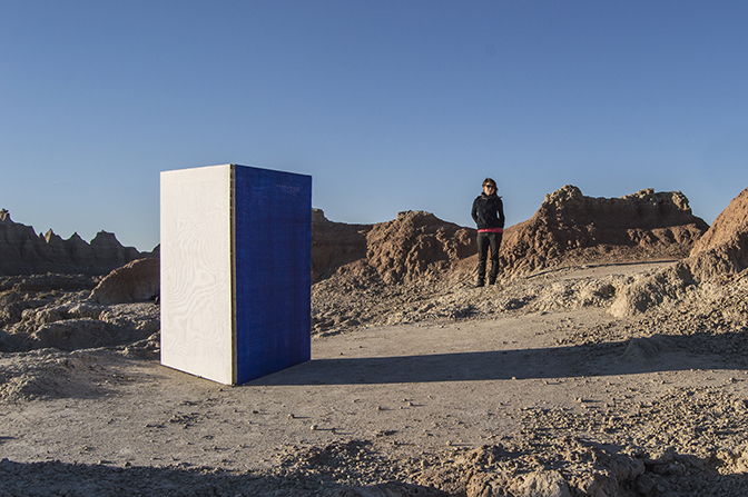 Gina Hunt, Mirroring  Theater scrim, acrylic on PVC mesh, and polyester screen mesh stretched over three painted frames and attached with steel hinges 48 inches x 36 inches x 36 inches Installed at Badlands National Park, South Dakota, 2016